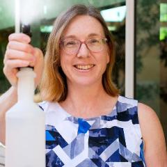researcher with spray bottle