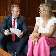 Minister for Energy, Renewables and Hydrogen & Minister for Public Works and Procurement, the Hon. Mick de Brenni and Professor Peta Ashworth OAM seated
